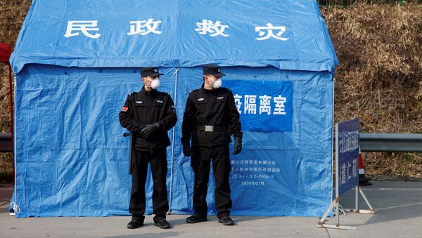 Pripadnici obezbeđenja na kontrolnom punktu u kineskoj provinciji Hunan - Sputnik Srbija