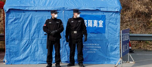 Pripadnici obezbeđenja na kontrolnom punktu u kineskoj provinciji Hunan - Sputnik Srbija