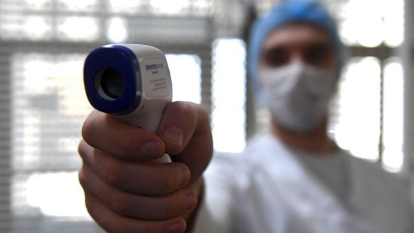 Merenje temperature – koronavirus - Sputnik Srbija