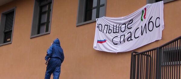 Руски војни експерт током дезинфекције против вируса корона у италијанском граду Вертова - Sputnik Србија