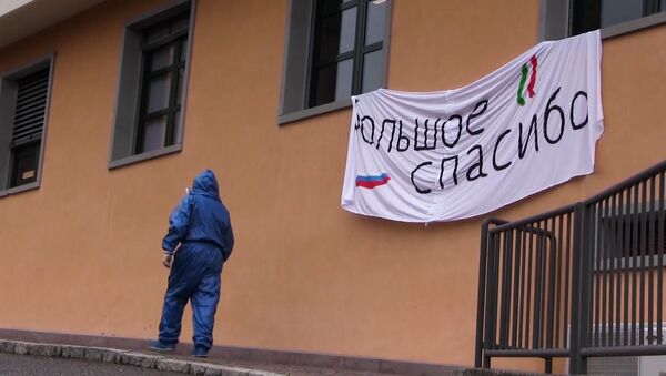 Руски војни експерт током дезинфекције против вируса корона у италијанском граду Вертова - Sputnik Србија