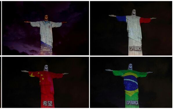 Zastave brojnih zemalja pogođenih virusom korona projektovane na statuu Hrista Spasitelja u Rio de Žaneiru - Sputnik Srbija