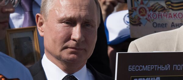 Руски председник Владимир Путин у акцији Бесмртни пук која се одржава поводом Дана победе - Sputnik Србија