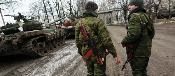 Повлачење тешког наоружања са истока Украјине Повлачење тешког наоружања са истока Украјине - Sputnik Србија