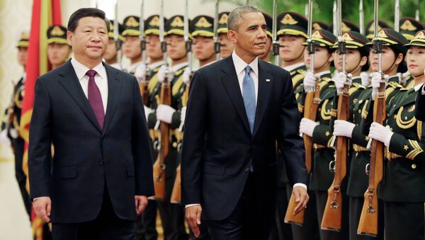 U.S. President Barack Obama and Chinese President Xi Jinping review the honor guard during a welcome ceremony at the Great Hall of the People in Beijing, Wednesday, Nov. 12, 2014. - Sputnik Srbija