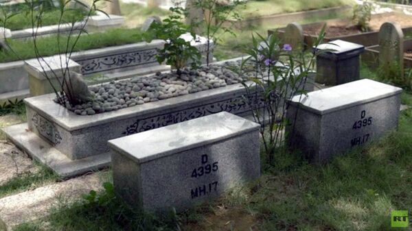 Malezijski avion, žrtve - Sputnik Srbija