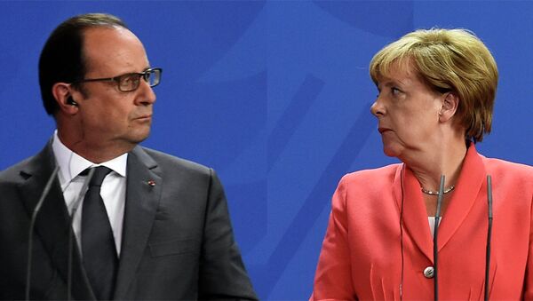 Fransoa Oland  i Angela Merkel - Sputnik Srbija
