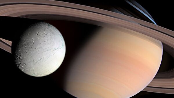Saturn i njegov satelit Encelad - Sputnik Srbija