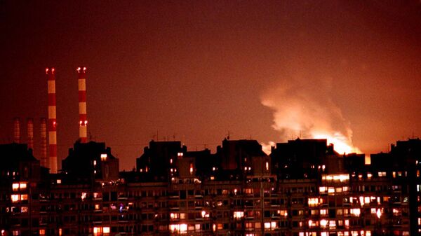 Flames from an explosion light up the Belgrade skyline near a power station after NATO cruise missiles and warplanes attacked Yugoslavia late Wednesday, March 24, 1999 - Sputnik Србија