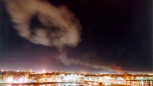 Smoke billows over the northern Yugoslav city of Novi Sad, some 70 kms. north of Belgrade after NATO air raids late Wednesday March 24, 1999. - Sputnik Србија